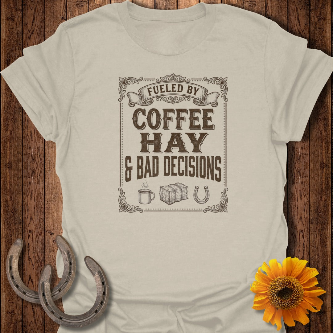 T-shirt with "Fueled by Coffee, Hay & Bad Decisions" text, coffee cup, and horseshoe graphic.