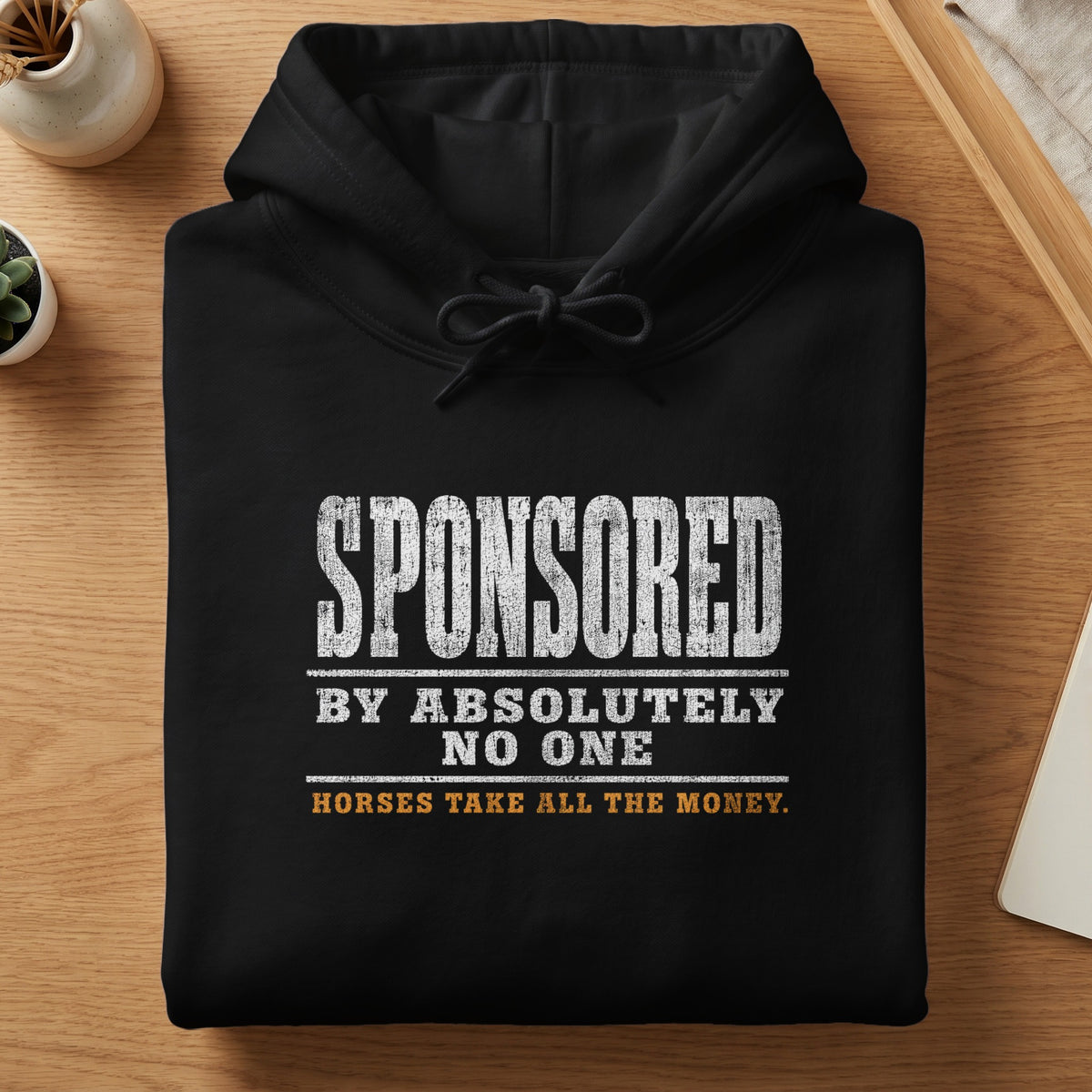 Black hoodie with distressed text: "SPONSORED BY ABSOLUTELY NO ONE HORSES TAKE ALL THE MONEY."