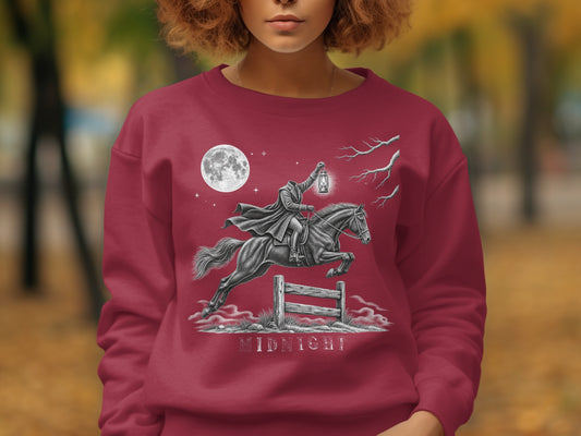 Headless horseman with lantern jumps fence under full moon, text "MIDNIGHT".