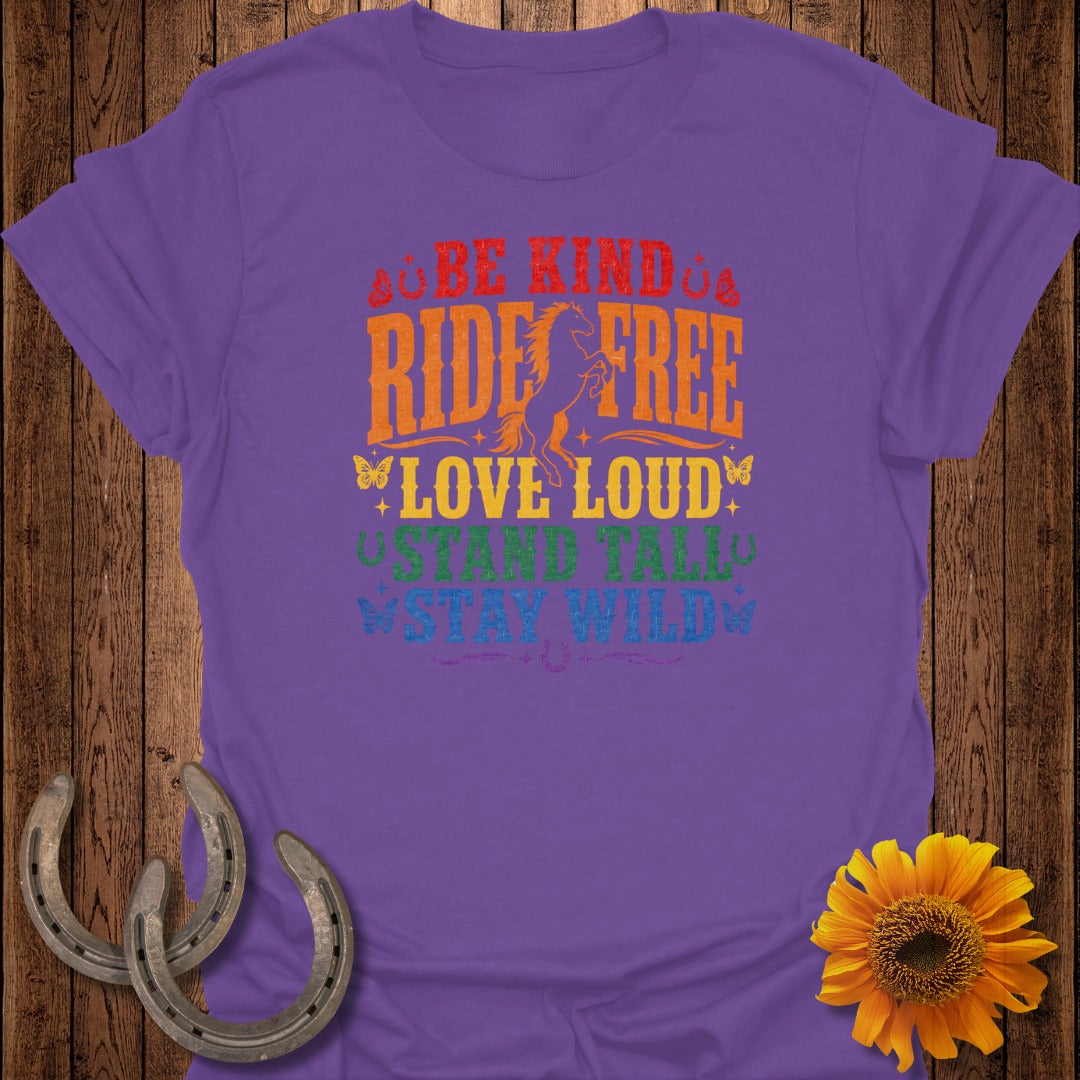 Purple t-shirt with text "Be Kind Ride Free Love Loud Stand Tall Stay Wild" and horse graphic.