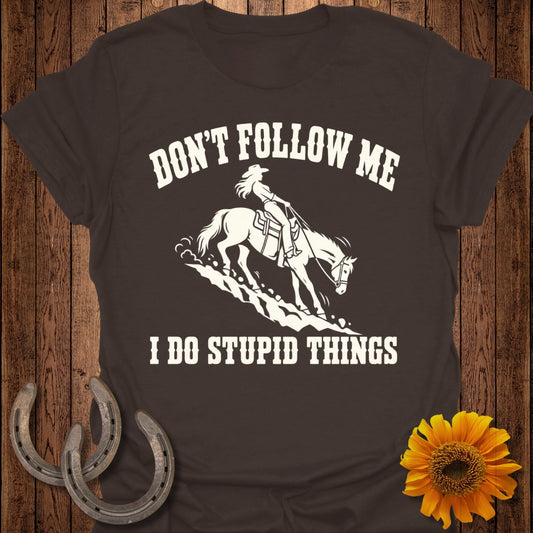 T-shirt with "Don't Follow Me I Do Stupid Things" text and horse rider graphic.