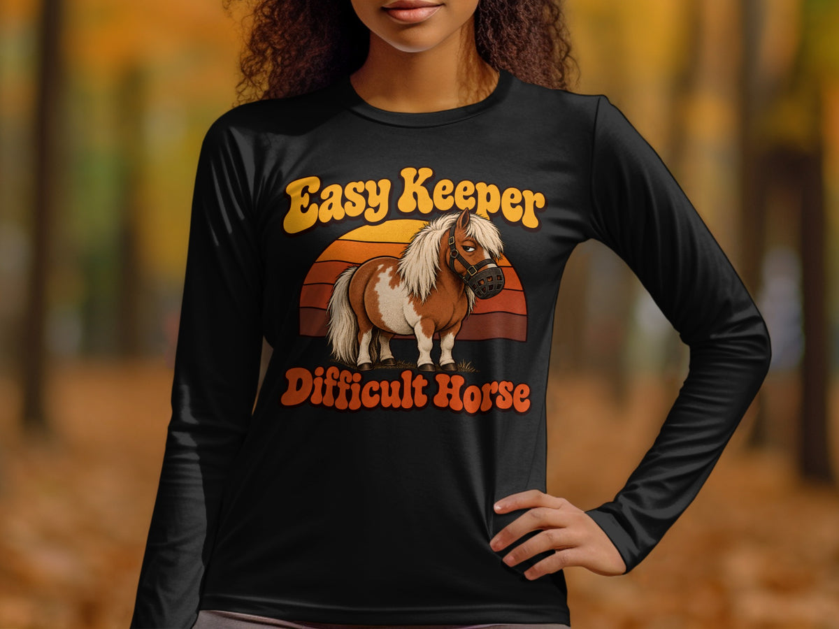 Black long-sleeve shirt with a cartoon horse and text "Easy Keeper Difficult Horse".