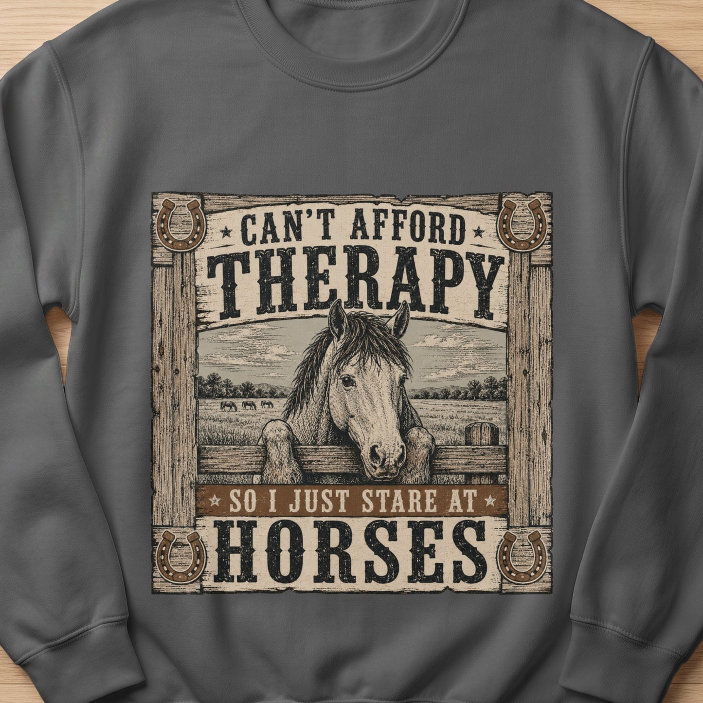 Grey sweatshirt with vintage design of a horse and text "Can't afford therapy so I just stare at horses".