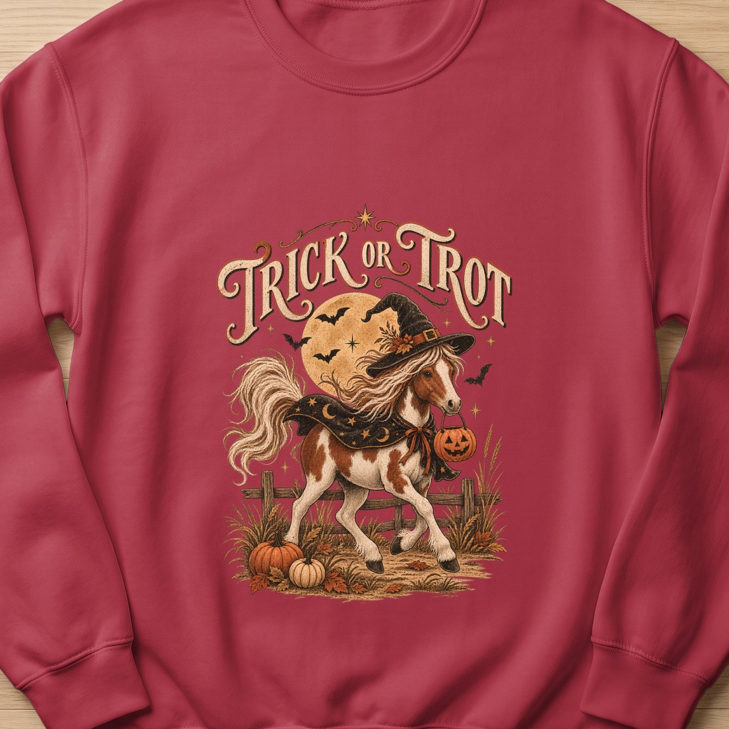 Horse in witch hat holding pumpkin with "Trick or Trot" text.