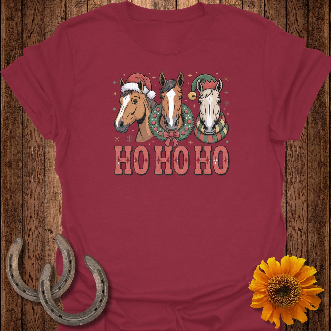 Three horses wear Santa hats and scarves with "HO HO HO" text below.