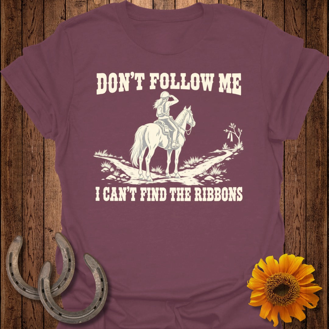 T-shirt with white text "Don't Follow Me I Can't Find The Ribbons" and horse rider graphic.