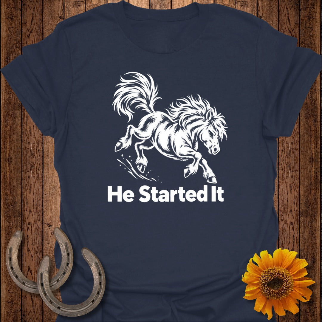 Navy t-shirt with white graphic of a galloping horse and text "He Started It".