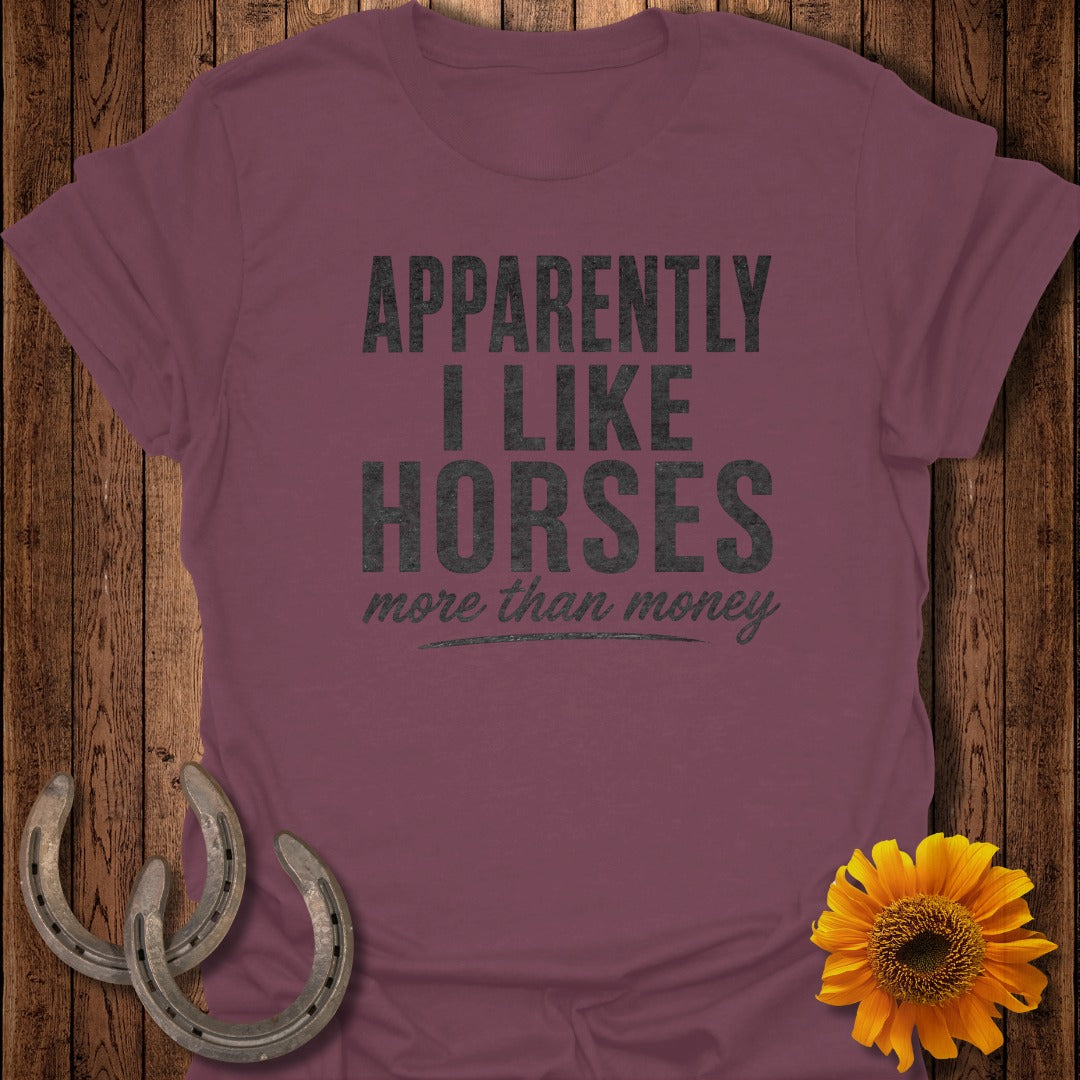 Maroon t-shirt with "Apparently I Like Horses more than money" text.