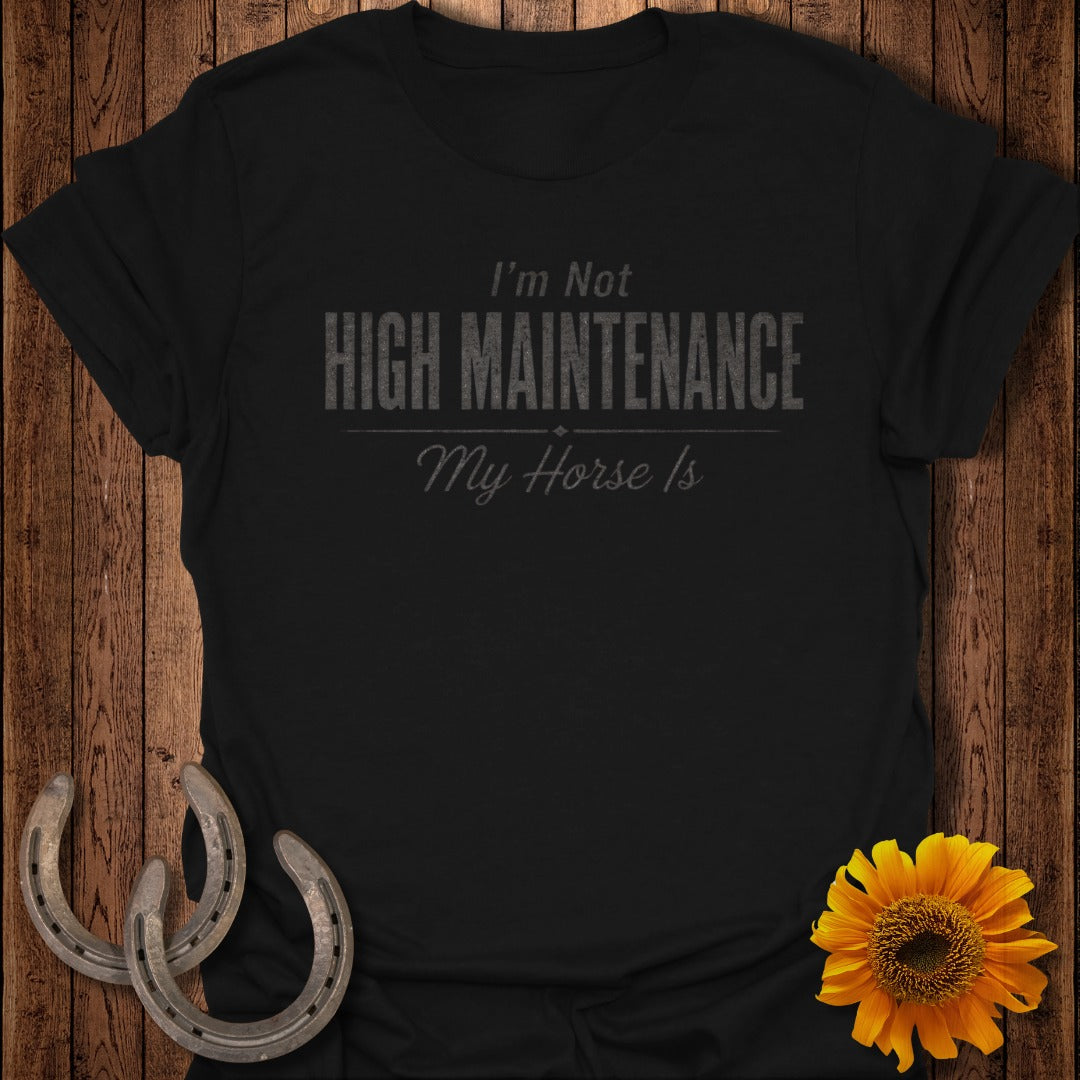 Black t-shirt with "I'm Not HIGH MAINTENANCE My Horse Is" text, horseshoes, and sunflower.