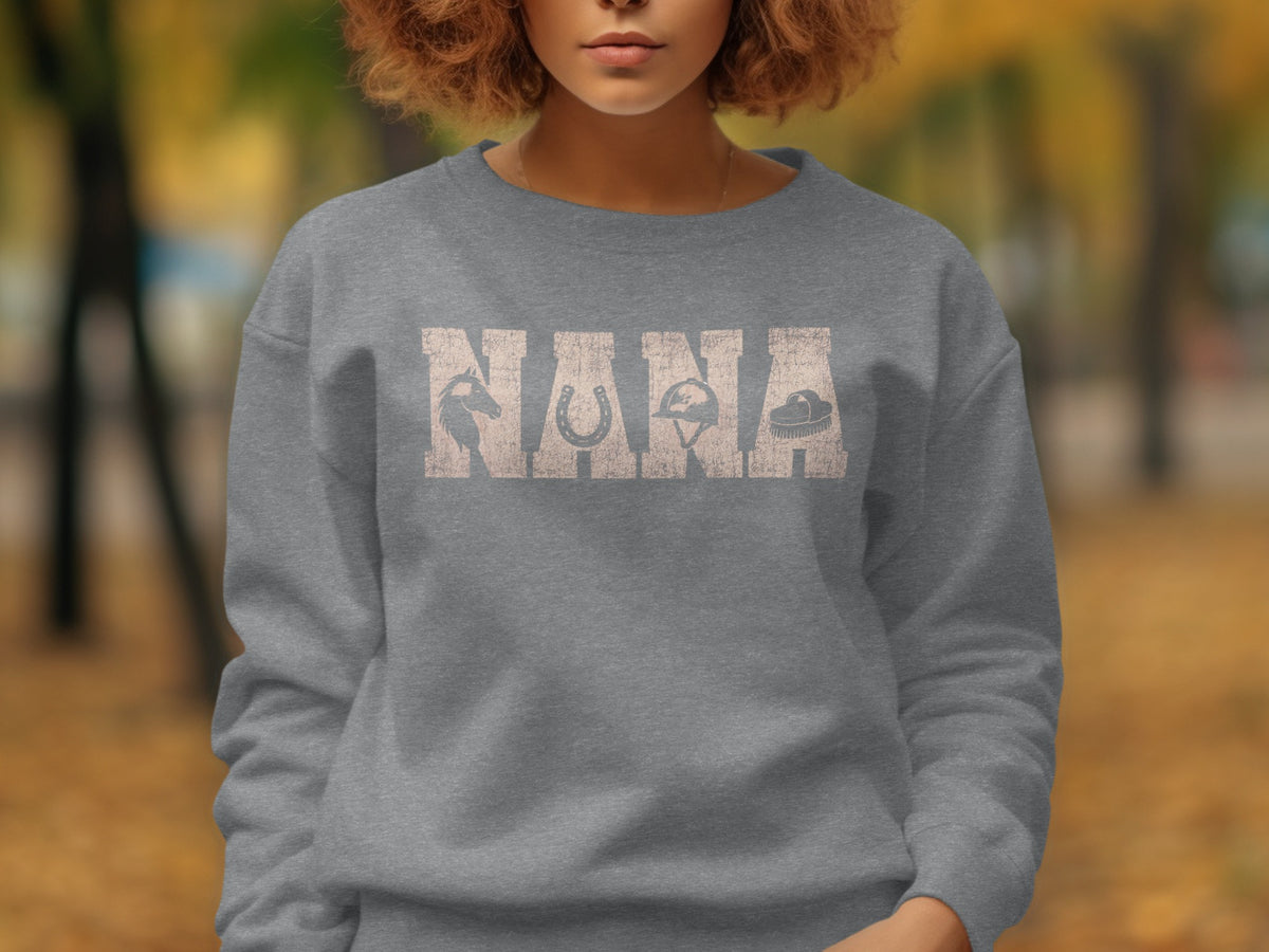 Grey sweatshirt with "NANA" text and equestrian graphics.
