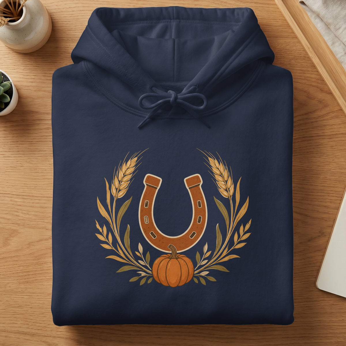 Navy hoodie with horseshoe, wheat, and pumpkin graphic.