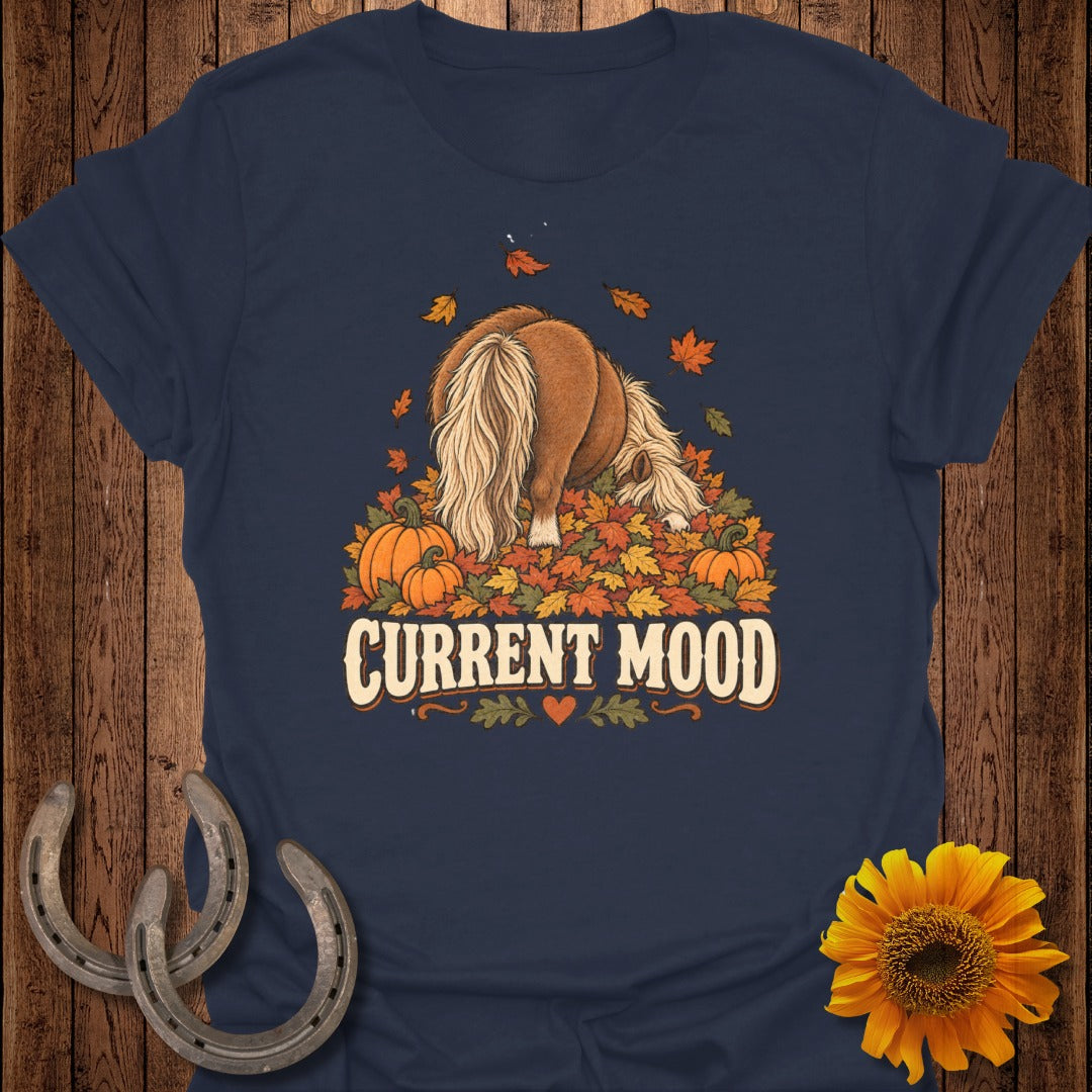 Pony with fluffy tail in autumn leaves and pumpkins, text "CURRENT MOOD"