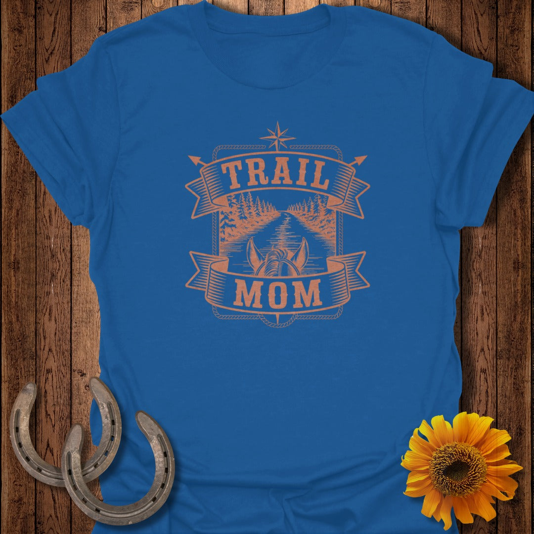 Blue t-shirt with orange "TRAIL MOM" text and forest road graphic.