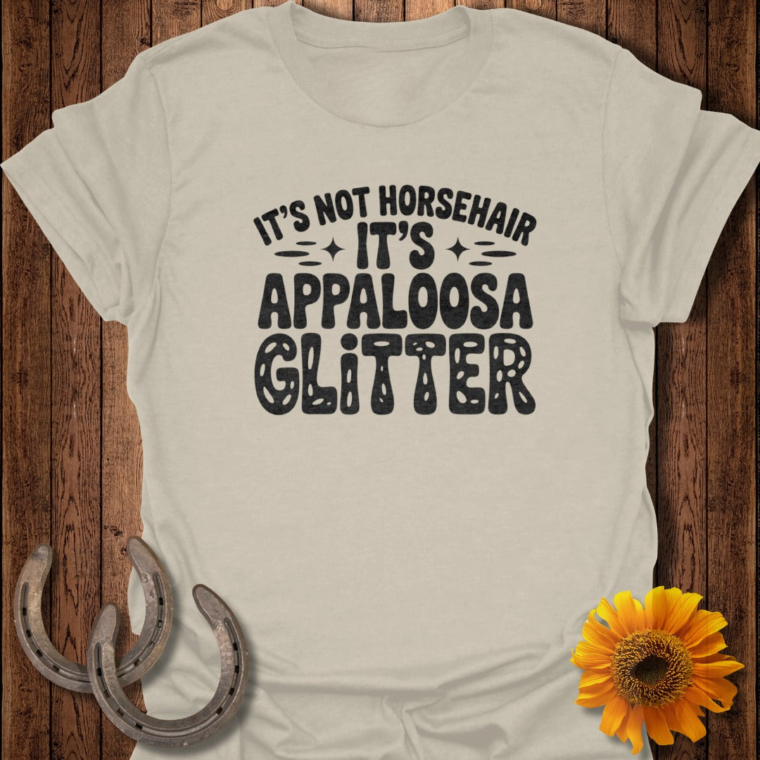 Light beige t-shirt with "It's Not Horsehair It's Appaloosa Glitter" text.