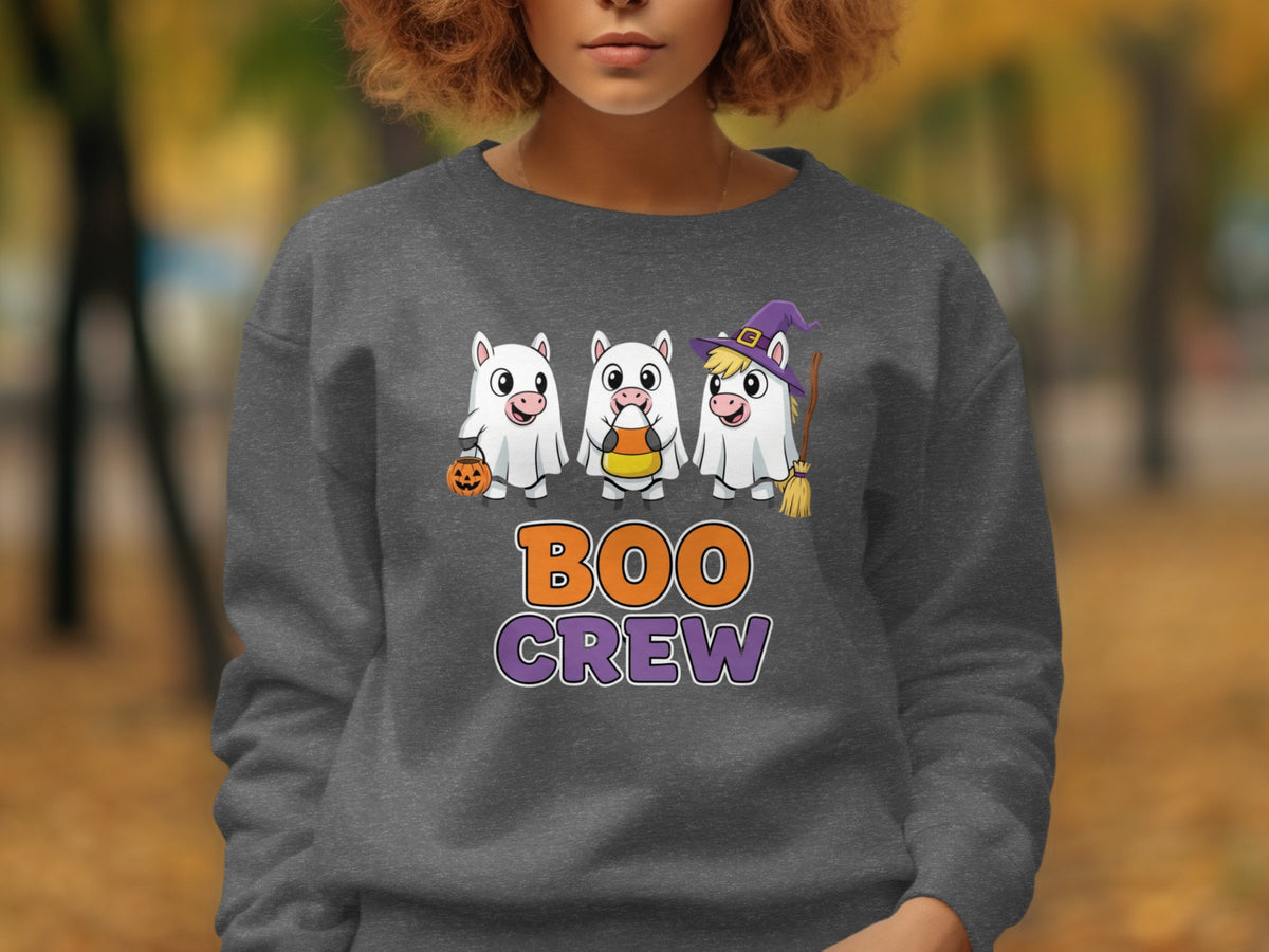 Three cartoon unicorns in ghost costumes with text "BOO CREW" below.