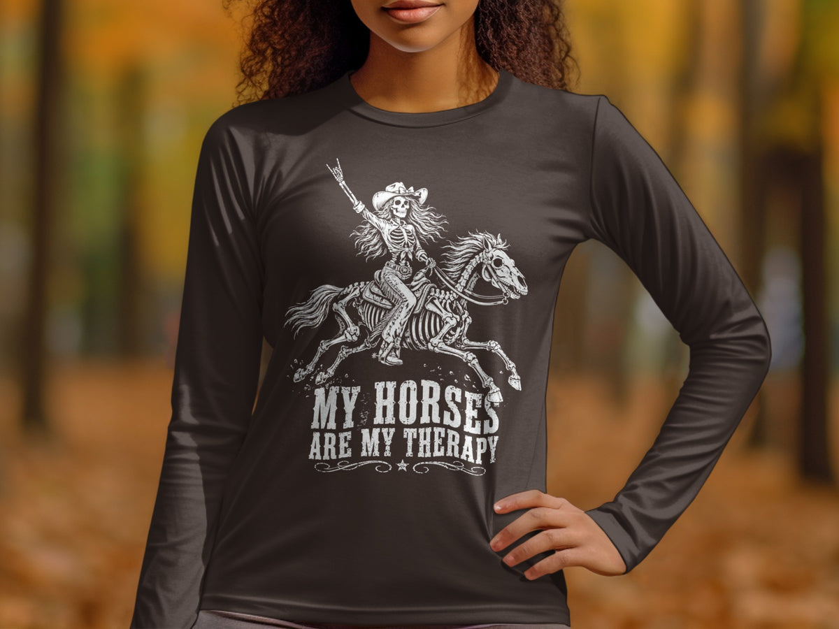 Dark long-sleeve shirt with white graphic of a skeleton riding a horse and text.