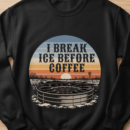 Black sweatshirt with "I break ice before coffee" text and a rural winter scene.