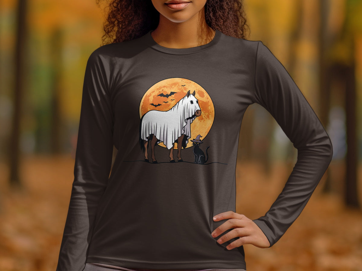 Horse dressed as a ghost with a cat on a moonlit night.