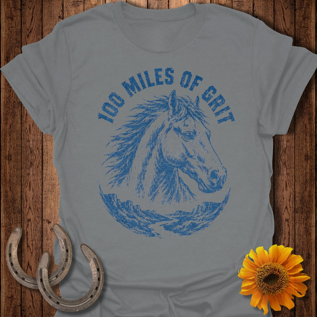 Grey t-shirt with blue horse head graphic and "100 Miles of Grit" text.
