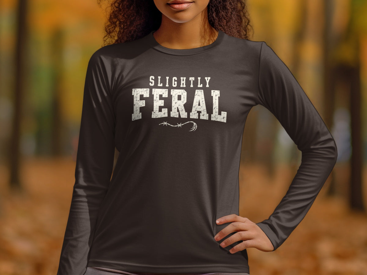 Dark long-sleeved shirt with "SLIGHTLY FERAL" graphic and barbed wire.