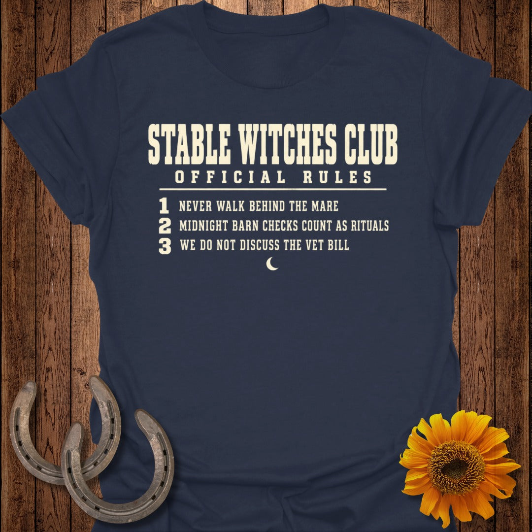 Navy t-shirt with "Stable Witches Club Official Rules" and three numbered rules.