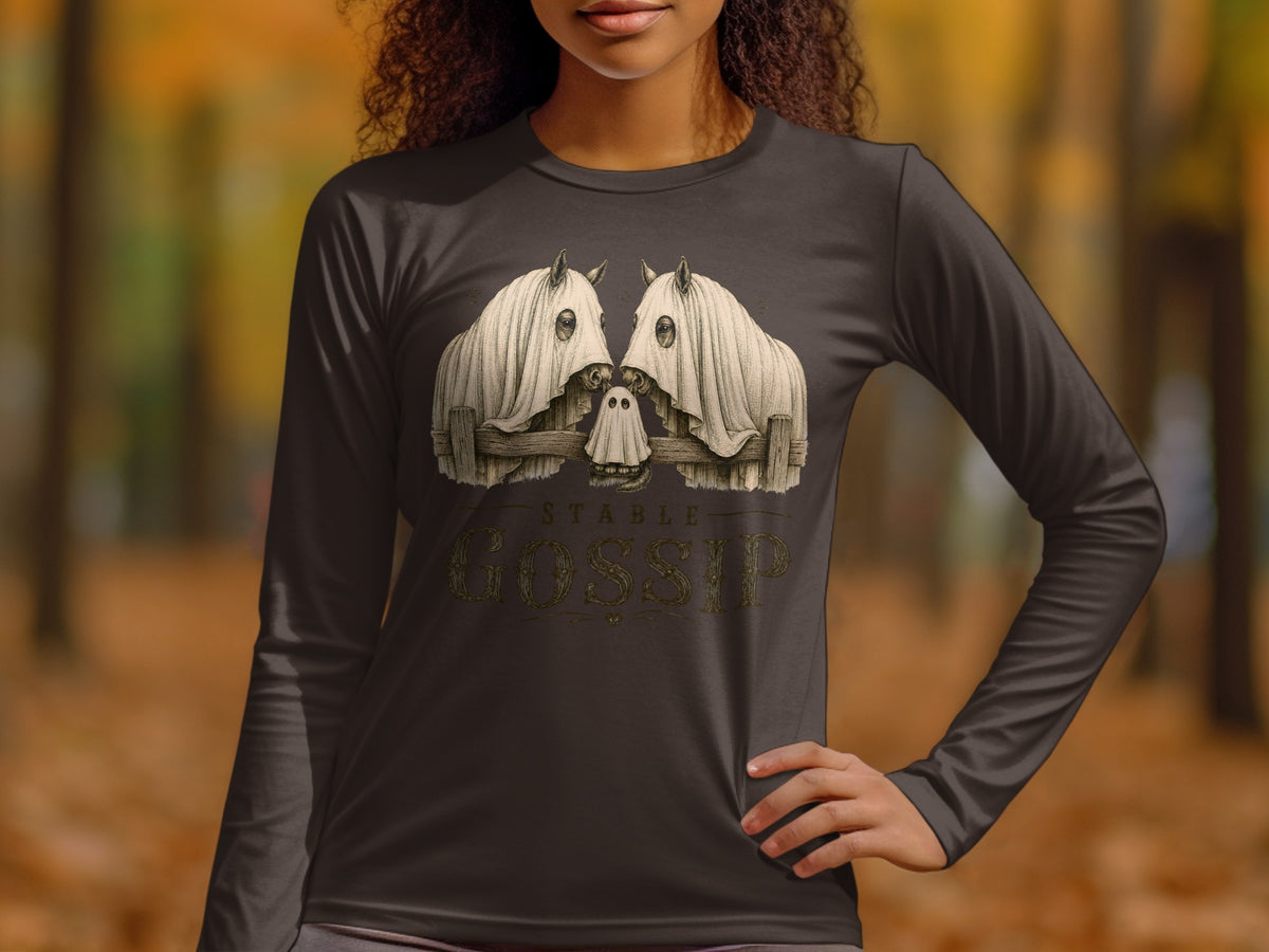 Two horses wearing ghost costumes with text "STABLE GOSSIP" on a dark long-sleeve shirt.