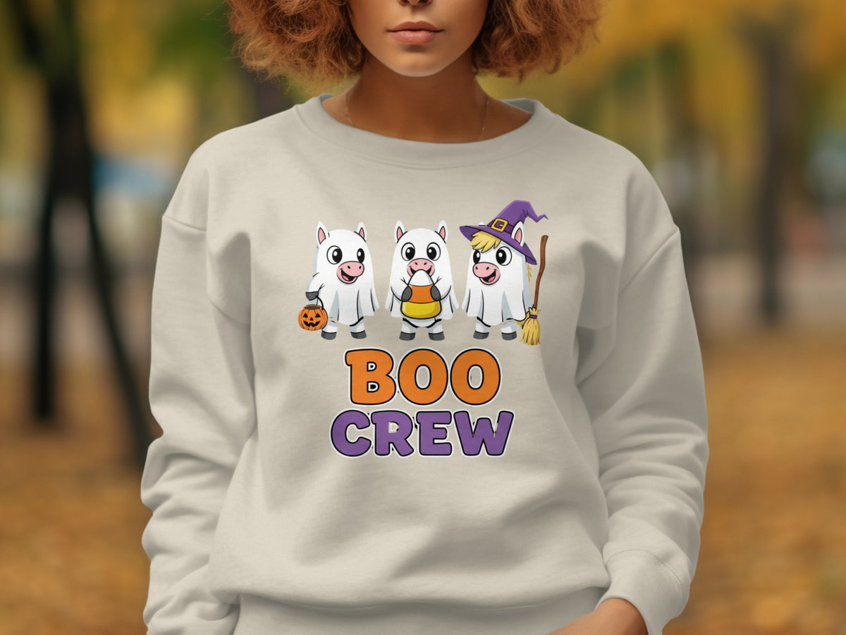 Cream sweatshirt with Boo Crew Halloween graphic featuring three ghost unicorns.