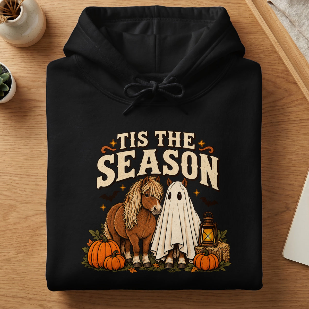 Black hoodie with "Tis The Season" text, a pony, and a ghost horse.
