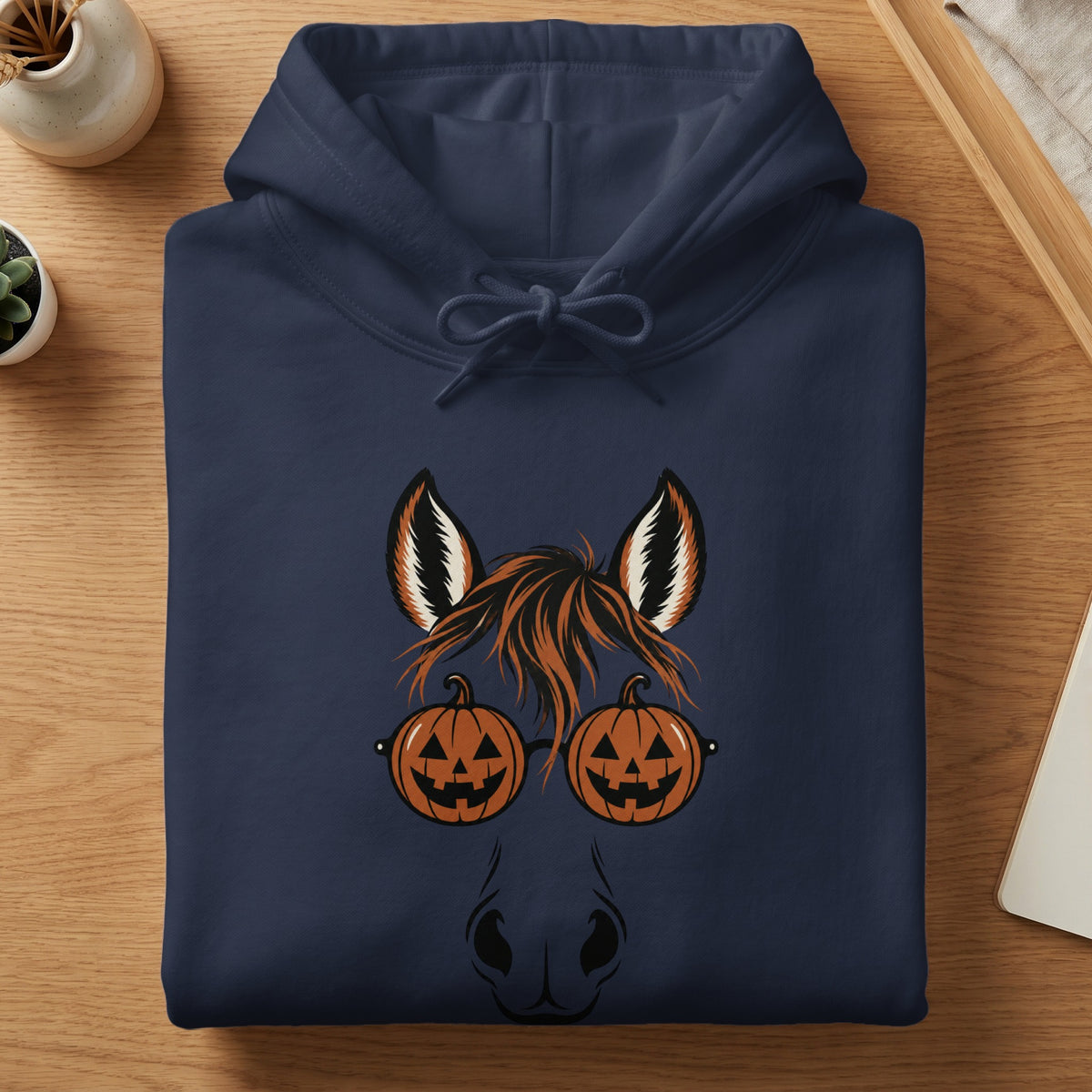 Navy hoodie with a horse graphic wearing pumpkin glasses for Halloween.