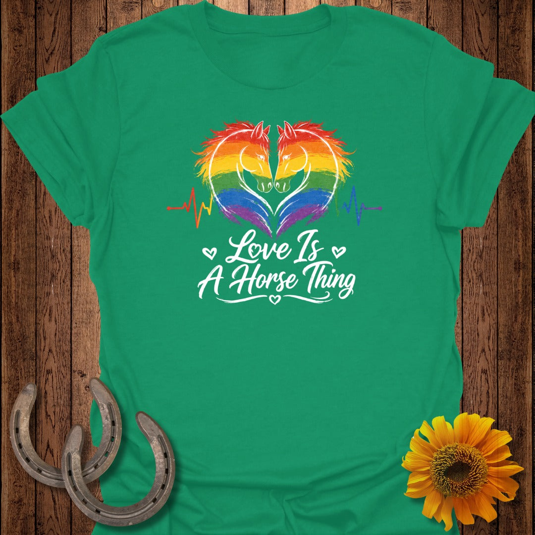 Green t-shirt with rainbow horse heads and text "Love Is A Horse Thing."