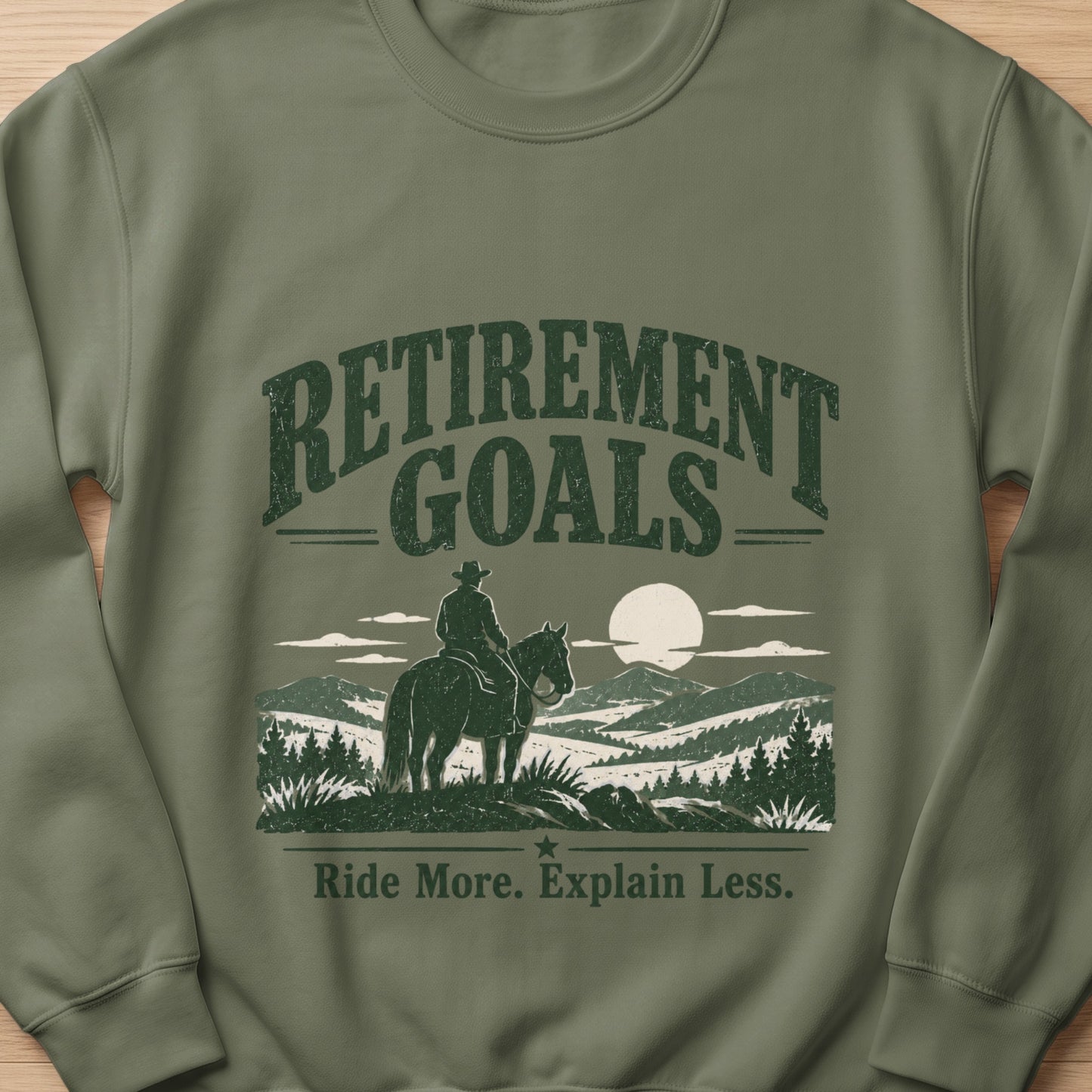 Crewneck sweatshirt with "Retirement Goals" and "Ride More. Explain Less." text.