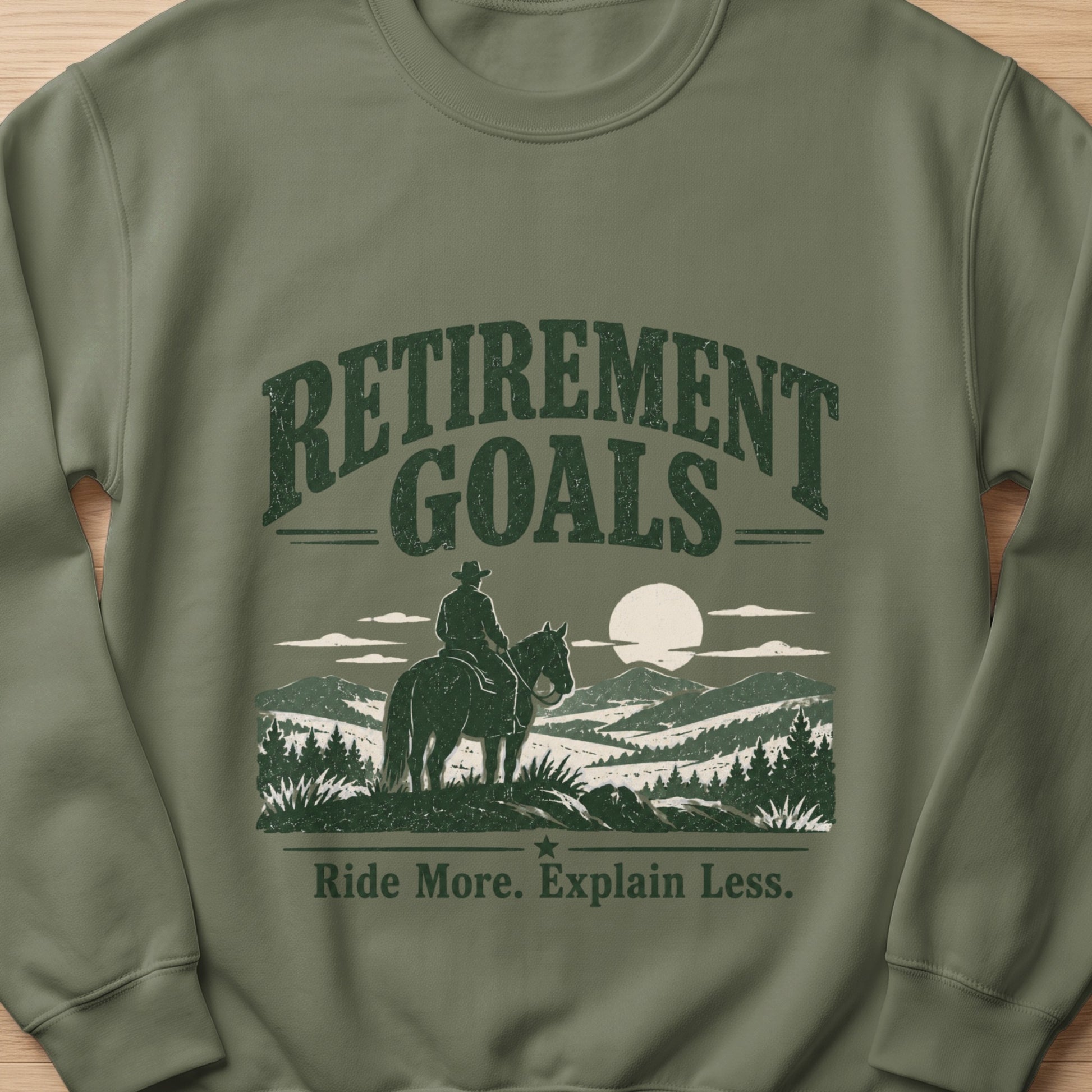 Crewneck sweatshirt with "Retirement Goals" and "Ride More. Explain Less." text.
