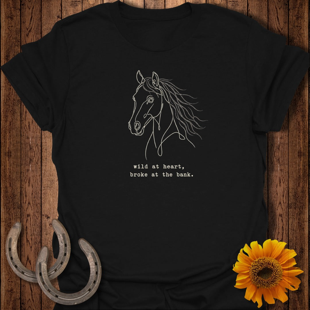 Black t-shirt with line art horse head and text "wild at heart, broke at the bank."