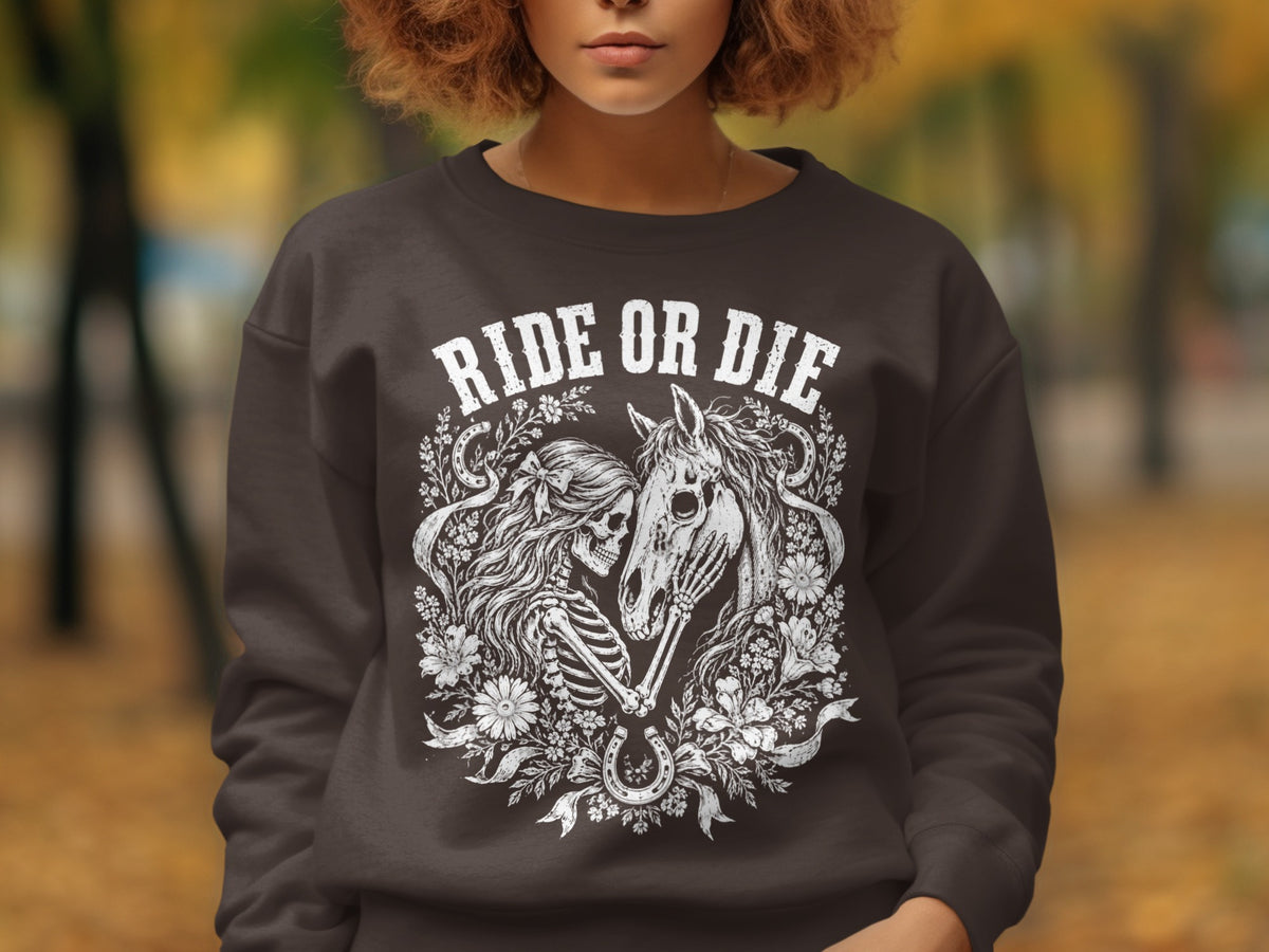 Dark brown sweatshirt with "Ride or Die" text and skeleton with horse graphic.
