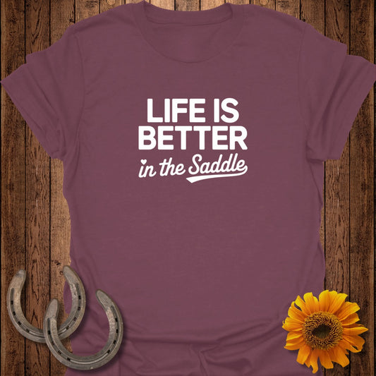 Burgundy t-shirt with "Life is Better in the Saddle" text, horseshoes, and sunflower.
