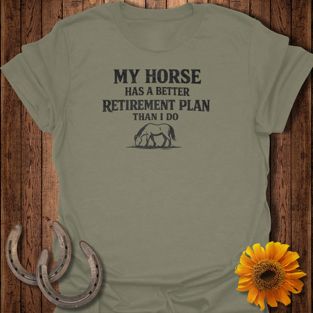 Olive green t-shirt with black text and horse graphic, "My horse has a better retirement plan than I do".
