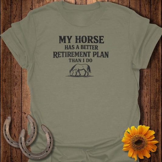 Olive green t-shirt with black text and horse graphic, "My horse has a better retirement plan than I do".