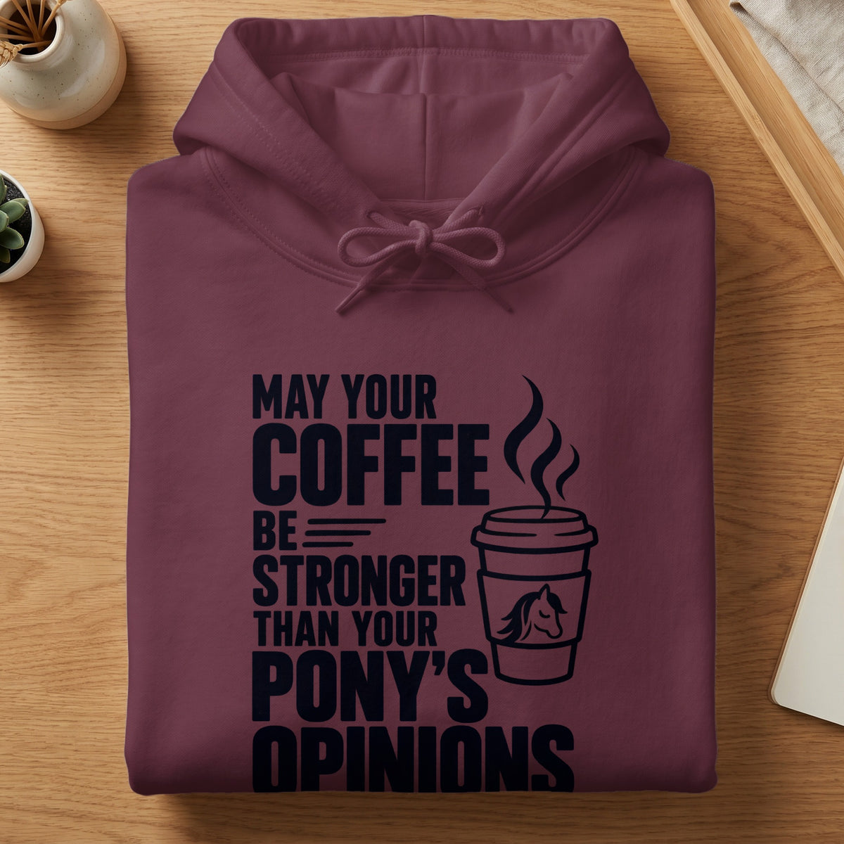 Maroon hoodie with text "MAY YOUR COFFEE BE STRONGER THAN YOUR PONY'S OPINIONS".