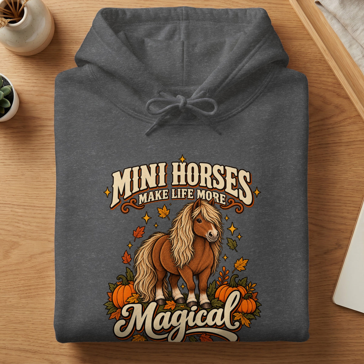 Dark gray hoodie with "Mini Horses Make Life More Magical" text and a mini horse graphic.