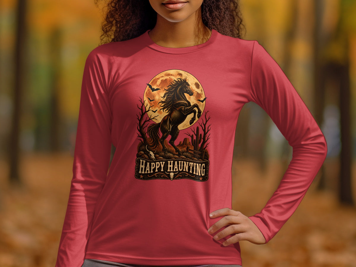 Long-sleeve shirt with rearing horse, bats, cactus, and "Happy Haunting" text.