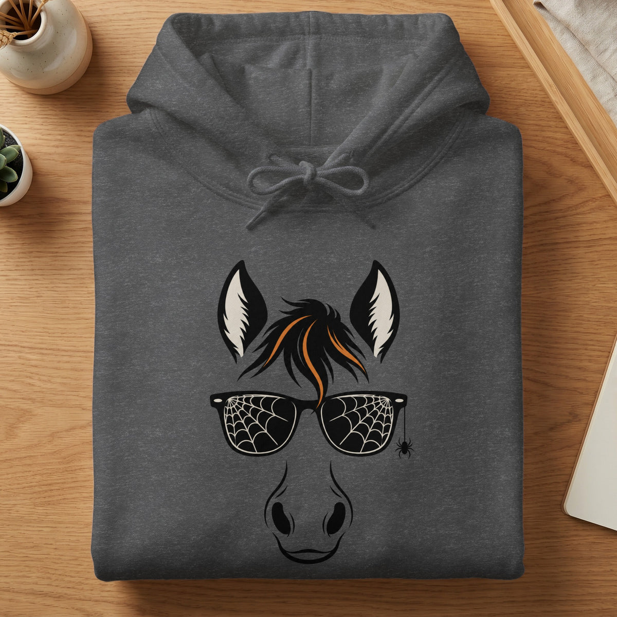 Dark grey hoodie with horse face graphic, spiderweb sunglasses, and hanging spider.