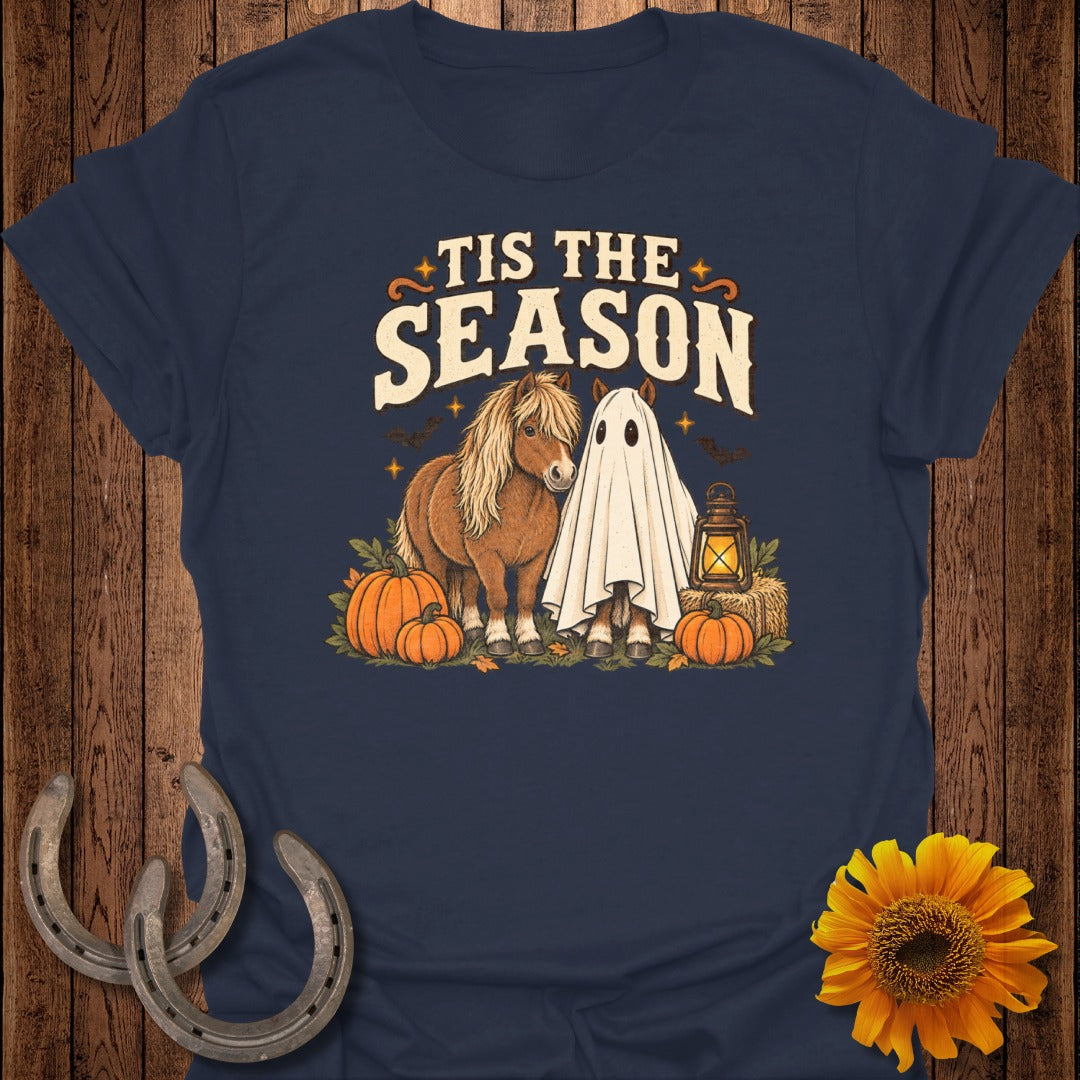 Pony dressed as a ghost with text "Tis The Season" and Halloween decor.
