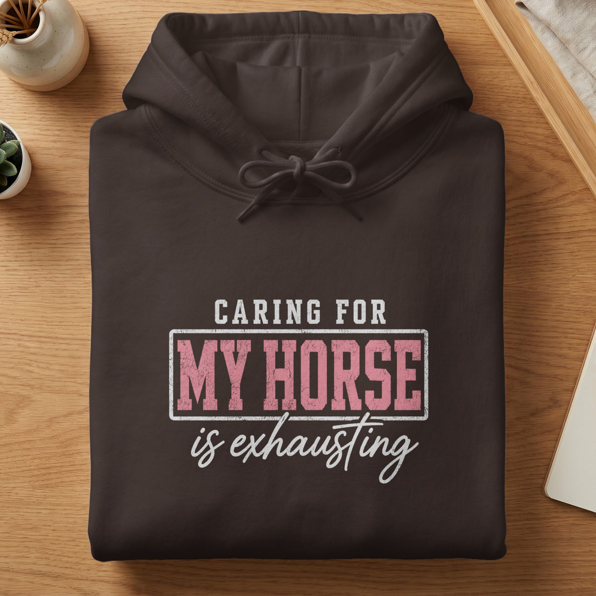 Dark brown hoodie with text "Caring for my horse is exhausting".