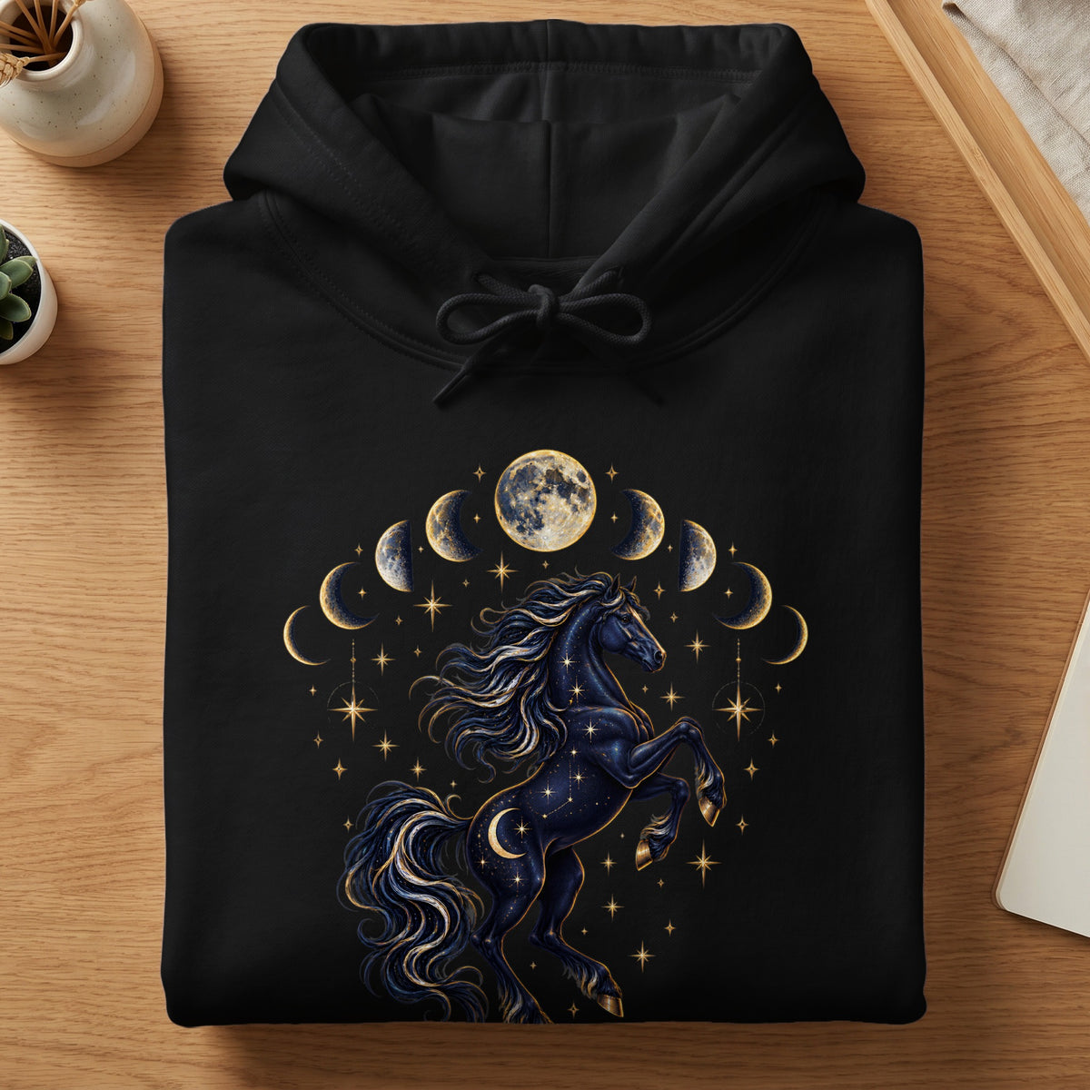 Black hoodie with a celestial horse and moon phases graphic.