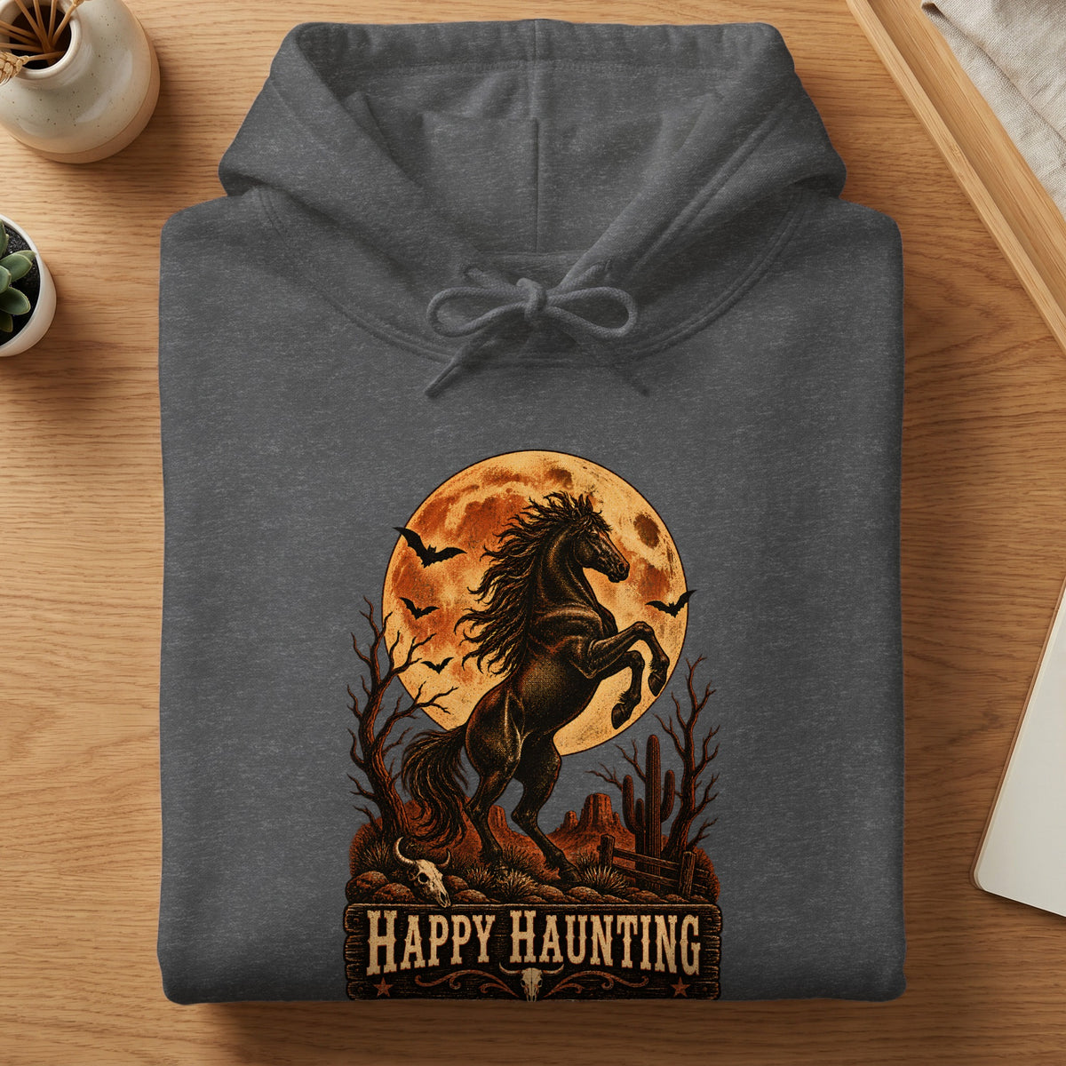 Dark grey hoodie with a distressed print of a rearing horse against a full moon and desert scene.