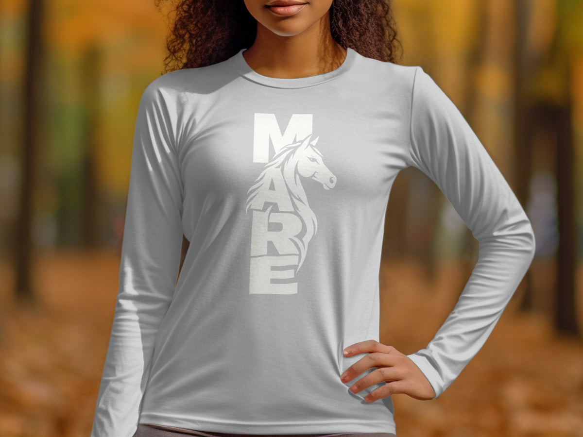 A woman wearing a light gray long-sleeved shirt with the word MARE and a horse graphic in white.