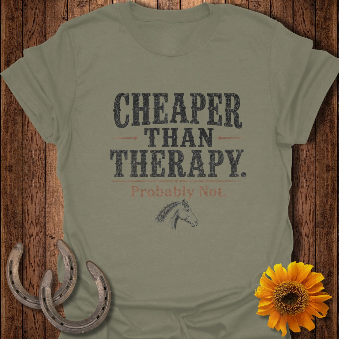 Olive green t-shirt with "Cheaper Than Therapy. Probably Not." and horse sketch.
