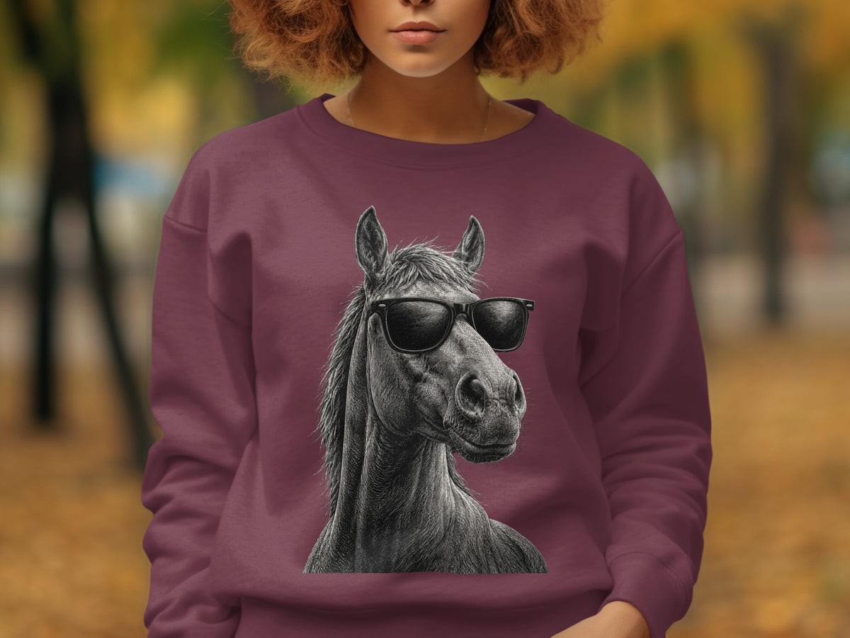 Maroon sweatshirt with a black and white illustration of a horse wearing sunglasses.