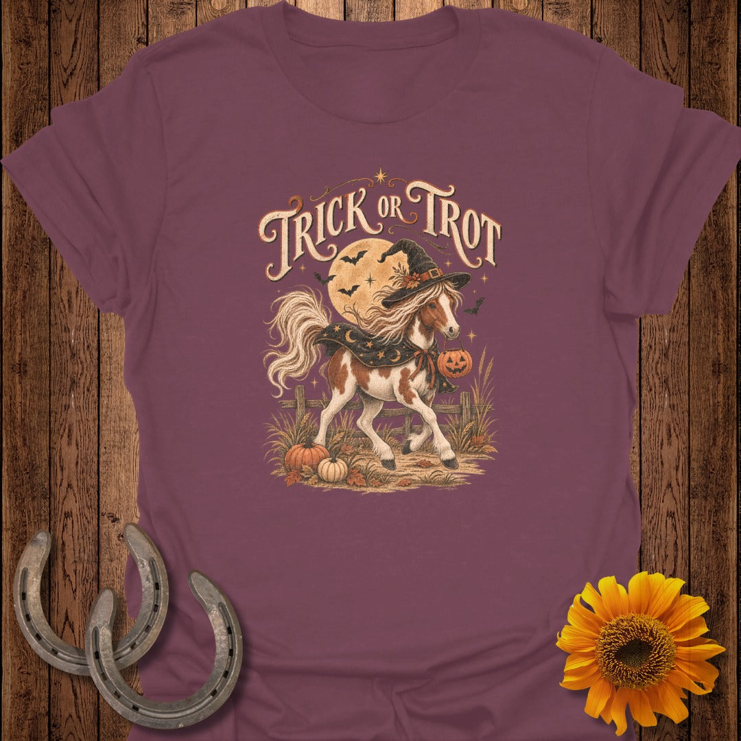 Horse wearing witch hat and cape with "Trick or Trot" text, pumpkins, and moon.