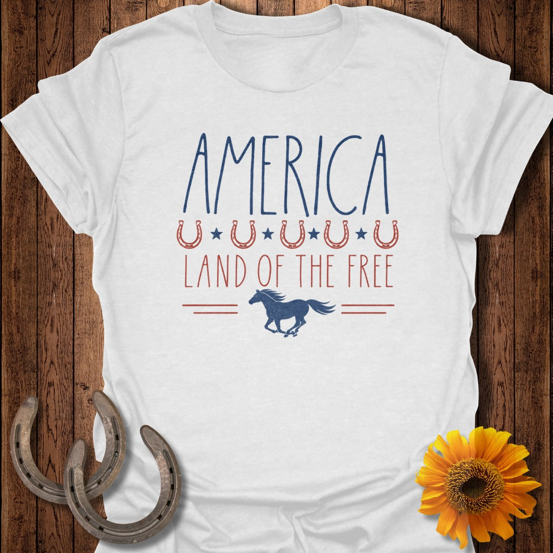 White t-shirt with "AMERICA LAND OF THE FREE" and horse graphic.